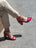 Sandales à talons carrés, ornées de brides fines et d’un talon tressé.